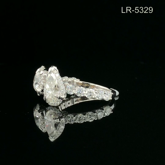 Pear & Round Cut Toi et Moi Diamond Ring with Halo & Pavé Band in Solid Gold.