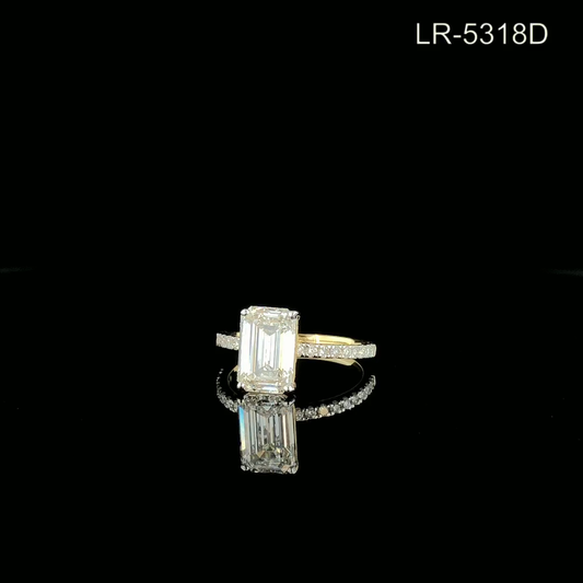 Emerald Cut Diamond Solitaire Ring with Pavé Band.