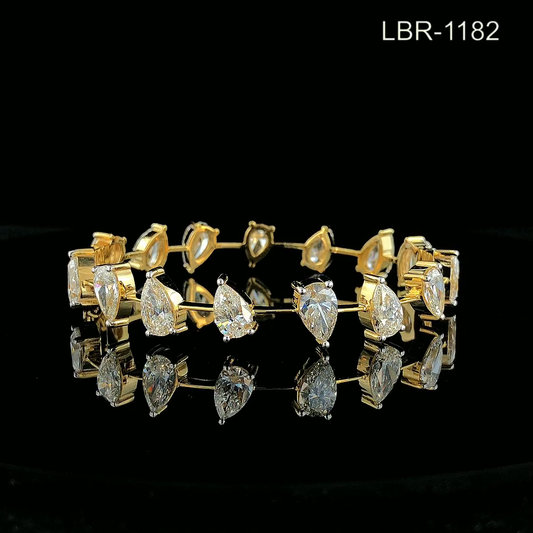 Pear Cut Diamond Tennis Bracelet with Prong Set Teardrop Stones.