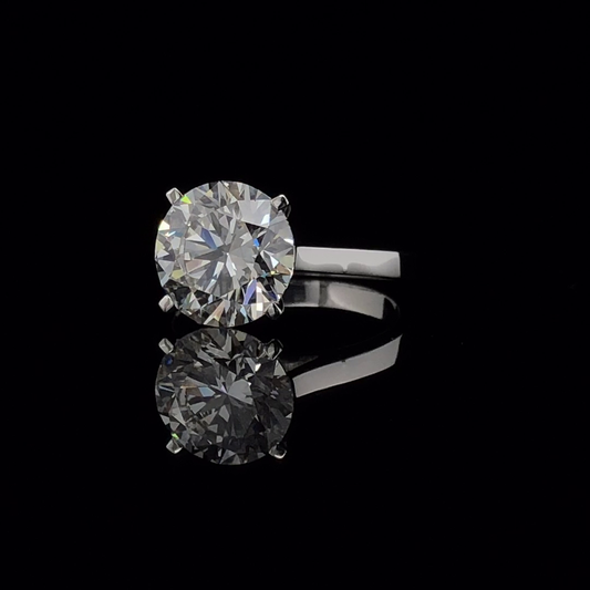 Round Brilliant Solitaire Engagement Ring, Four Prong Plain Knife Edge Band.